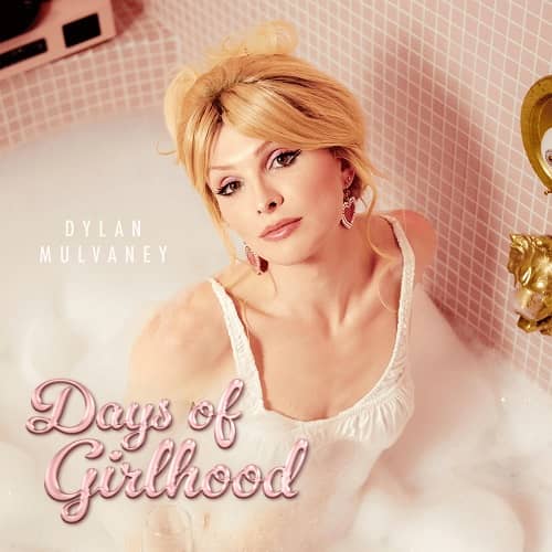 Dylan Mulvaney Days of Girlhood MP3 Download - "Days of Girlhood" by Dylan Mulvaney emerges as a poignant anthem, narrating a profound journey of self-discovery and empowerment. Skillfully produced by the talented Jami Arceo.